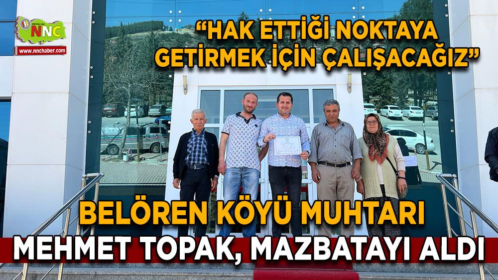 Belören Köyü muhtarı Mehmet Topak, mazbatayı aldı