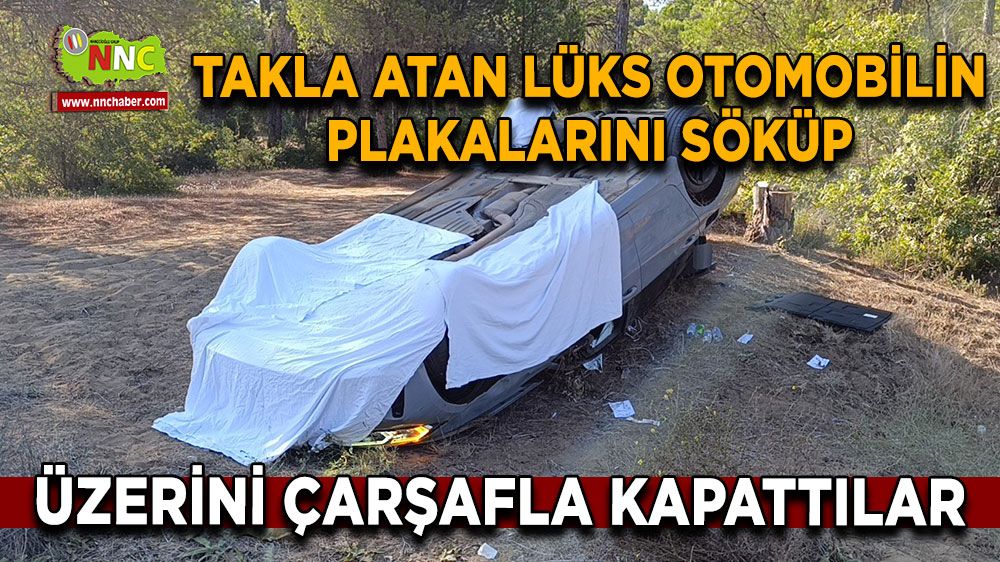 Antalya'da takla atan lüks otomobilin plakalarını söküp üzerini çarşafla kapattılar