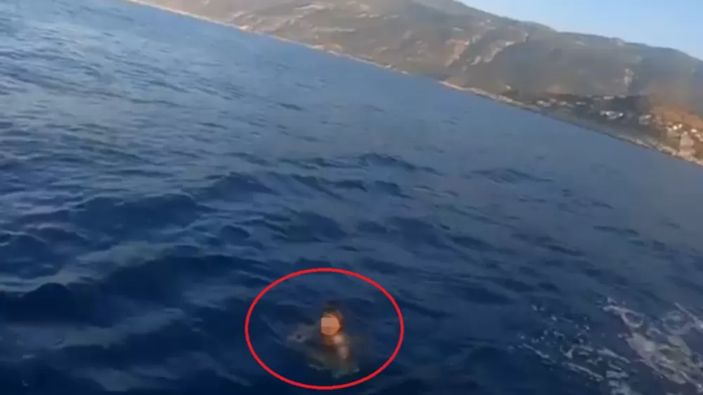 Hapis cezası ile aranıyordu, Yunan adasına yüzerek kaçmaya çalışırken yakalandı